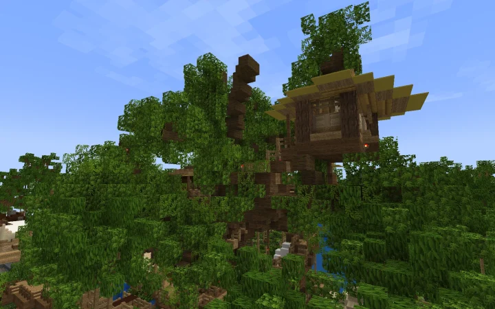 The Swiss Family Treehouse rising out of the jungle canopy in Magic Parks Adventureland, its thatched rooms built into the branches of a banyan tree